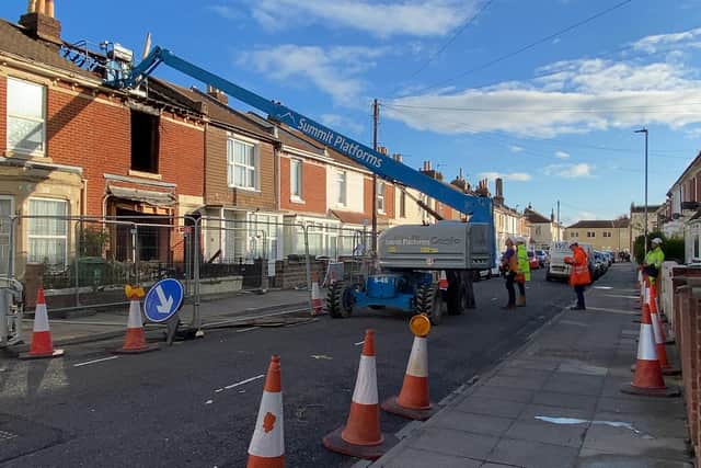 Demolition crews inspect the destroyed home in Nelson Avenue, North End. Photo: Tom Cotterill