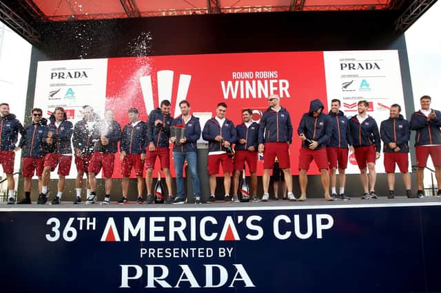 Ineos Team UK and skipper Sir Ben Ainslie celebrate with the Christmas Cup following their victory in the Prada Cup round robins off Auckland Harbour. Photo by Phil Walter/Getty Images.