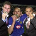 Nigel Quashie, centre, celebrates Pompey's Division One title triumph. Picture: Steve Reid