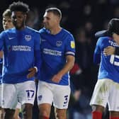 Danny Cowley, right, celebrates Pompey's win against AFC Wimbledon with Mahlon Romeo     Picture: Joe Pepler