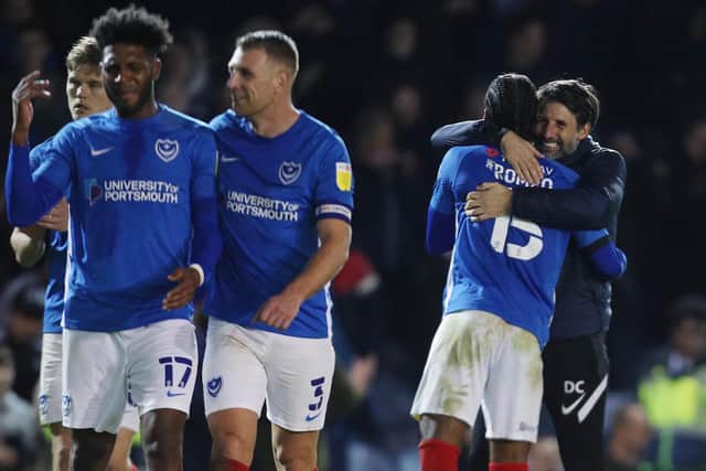 Danny Cowley, right, celebrates Pompey's win against AFC Wimbledon with Mahlon Romeo     Picture: Joe Pepler