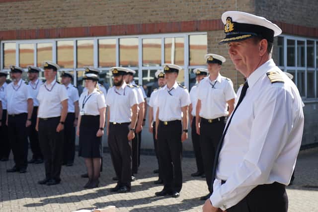 Capt Voyce, pictured right, says farewell to staff within the Royal Naval Air Engineering and Survival Equipment School