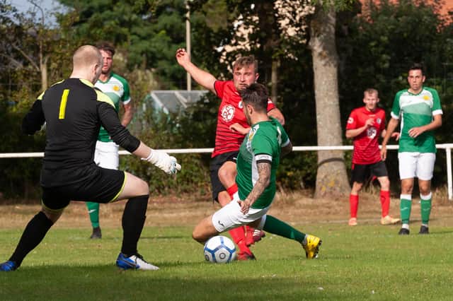 Ryan Bath (red) took his seasonal tally to 29 with a brace as Locks Heath ended Denmead's 20-game unbeaten league run.
Picture: Keith Woodland
