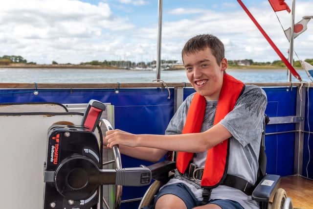Rowan Hayward (19) takes charge of the accessible controls on the Rebecca Anne. Picture: Mike Cooter (200822)