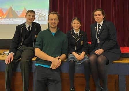 Record breaking explorer, George Bullard, alongside children from Boundary Oak School.