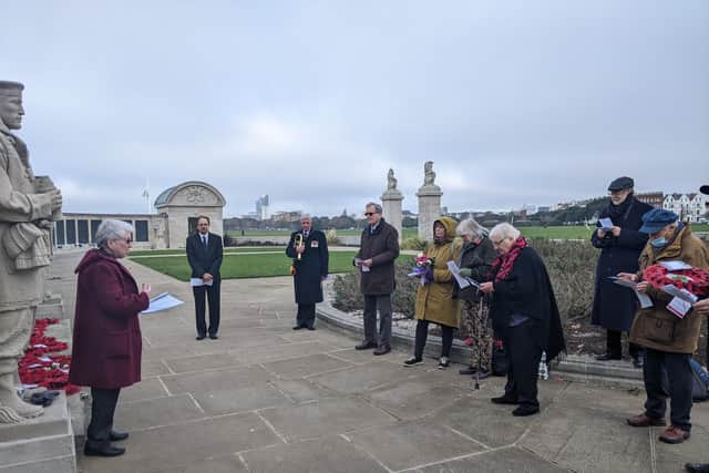 The reverend reads the service at Portsmouth Naval Memorial. Picture: Emily Turner