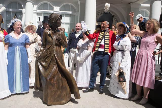 A life size statue of Jane Austen is unveiled by the Countess of Portsmouth to mark 200 years since the author's death, in Basingstoke, Hampshire.