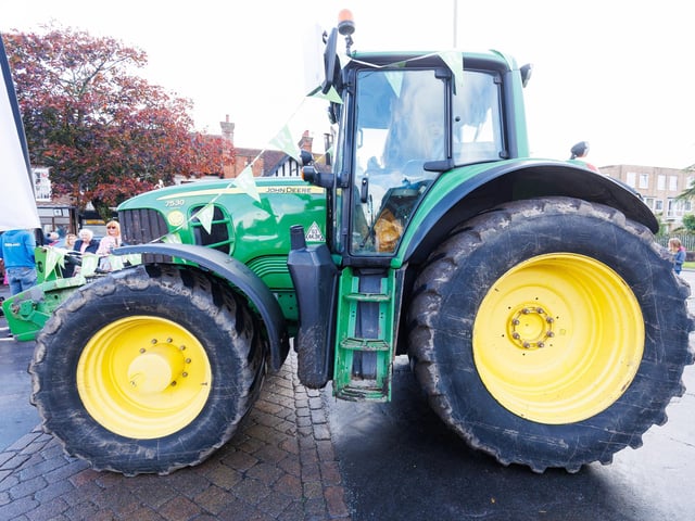 Crowds gathered in Wickham Square to watch the procession of tractors go by all to raise money for Rowans Hospice and Guide Dogs.