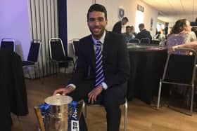 Danny Rose poses with the League Two trophy he won at Pompey in May 2017