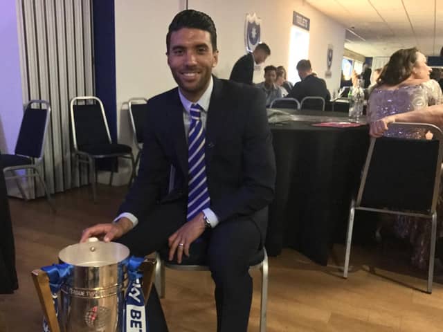 Danny Rose poses with the League Two trophy he won at Pompey in May 2017