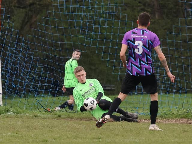 The Emsworth Town reserves goalkeeper saves a penalty during his team's 3-0 loss against Al's Bar in City of Portsmouth Sunday League Division Four. Picture: Kevin Shipp