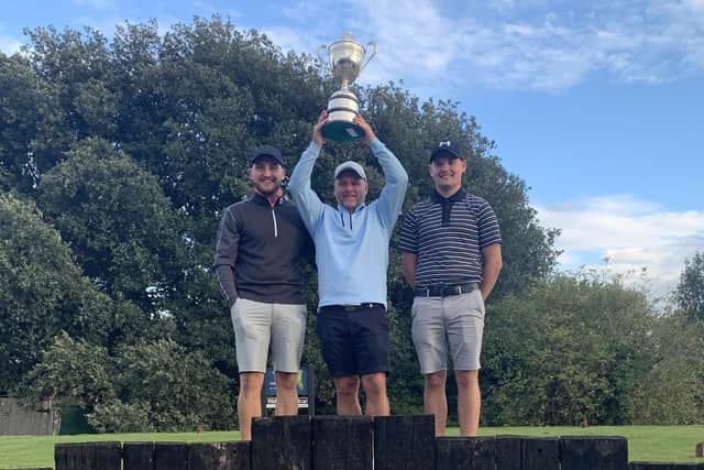 Stokes Bay winner Jon Evans is flanked by sons Perry (left) and Oakley after claiming the Club Championship silverware.