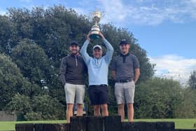 Stokes Bay winner Jon Evans is flanked by sons Perry (left) and Oakley after claiming the Club Championship silverware.