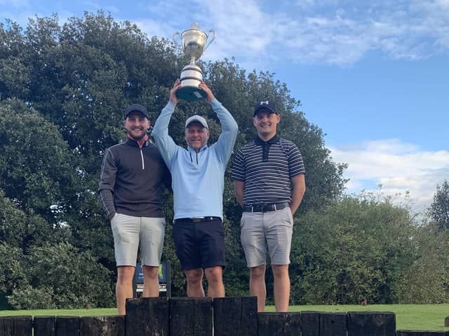 Stokes Bay winner Jon Evans is flanked by sons Perry (left) and Oakley after claiming the Club Championship silverware.