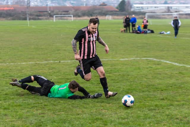 A Spartan Athletic player rounds the King George Rovers goalkeeper in his side's City of Portsmouth Sunday League Division 6 4-2 win last weekend Picture: Mike Cooter