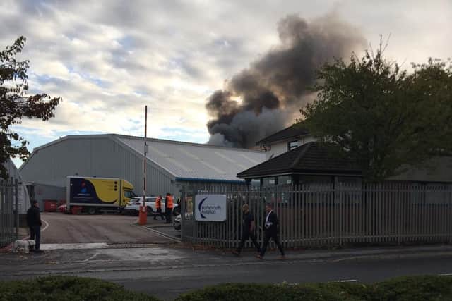 Fire crews and South Central Ambulance Service are in Airport Service Road in Copnor on October 13 after a fire at Portsmouth Aviation. Picture: Kev Parker