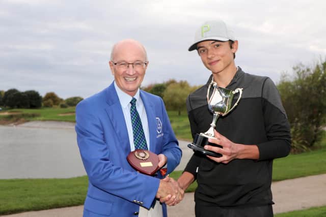 Rowlands Castle’s James Plater, the 2022 Hampshire Schools Boys champion, with club captain Ian Freegard at Cams Hall GC. Picture by Andrew Griffin.