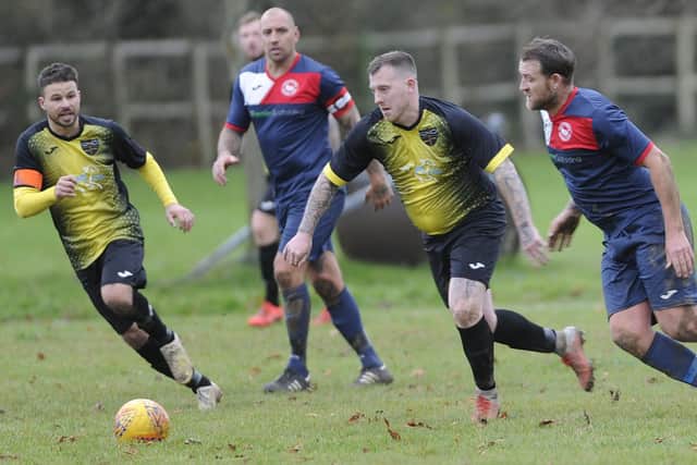 Infinity (yellow) take on Paulsgrove  at Knowle in 2019/20 - both clubs are protecting unbeaten Senior Division records in 2020/21. Picture: Ian Hargreaves