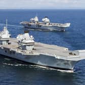 HMS Prince of Wales, front, pictured for the first time at sea with her sister ship HMS Queen Elizabeth, rear.