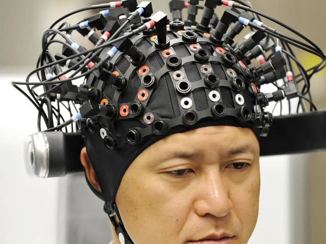A man wears a brain-machine interface, equipped with electroencephalography (EEG) devices at Japanese auto giant Honda's headquarters in Tokyo on March 31, 2009. 
Picture: Yoshikazu Tsuno/AFP via Getty Images