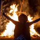 Adam Granger - leading the Pentacle Drummers - at the climax of the Beltain celebrations with the burning wickerman in the background.