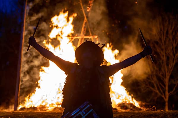 Adam Granger - leading the Pentacle Drummers - at the climax of the Beltain celebrations with the burning wickerman in the background.