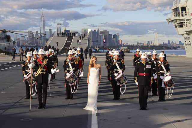Pictured: Katherine Jenkins OBE performs with the Royal Marine Band during the Sunset Ceremony.