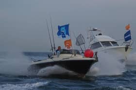 Boats race for prime positions at the start line for the Sea Angling Classic