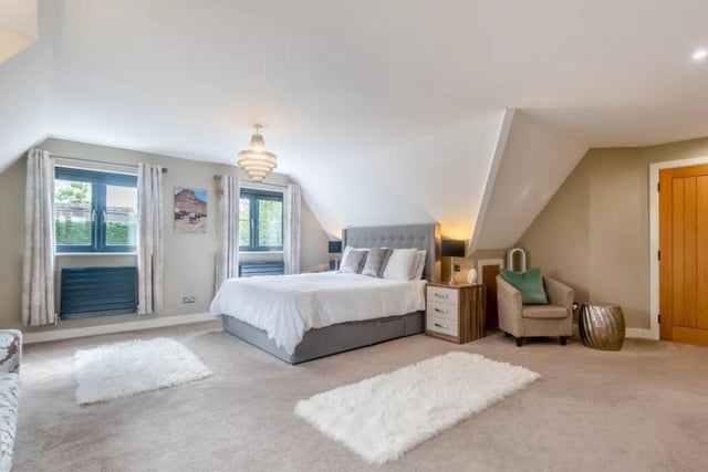 The listing says:  "Of particular note is the double height sitting room with cathedral style window, a striking, highly specified kitchen/dining room with Siemens appliances, Quooker tap, two full height refrigerators and granite worksurfaces."