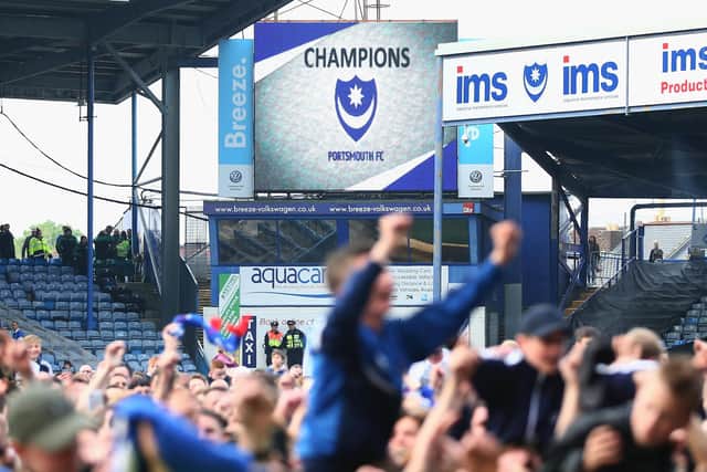 Pompey fans celebrate on the Fratton Park pitch after the 2017 League Two title was clinched on the final day of the season. Picture: Harry Murphy/Getty Images