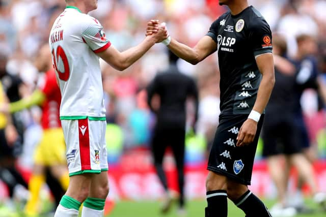 Louis Dennis shakes hands with Wrexham's Paul Mullin following Bromley's 1-0 FA Trophy triumph on Sunday. Picture: Kieran Cleeves/PA Wire