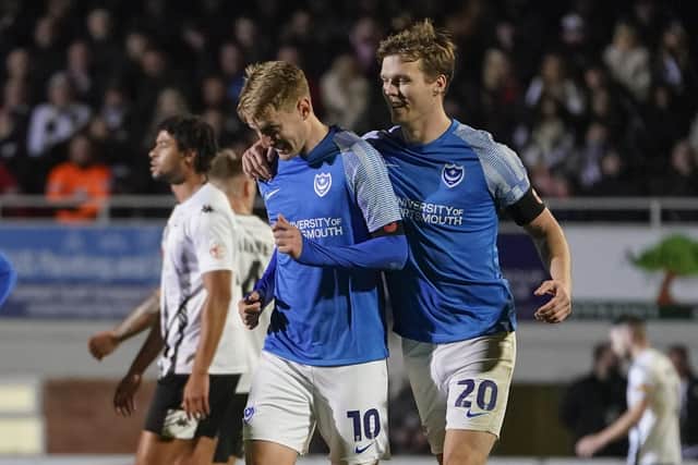 Joe Pigott is congratulated for his goal at Hereford by team-mate Sean Raggett