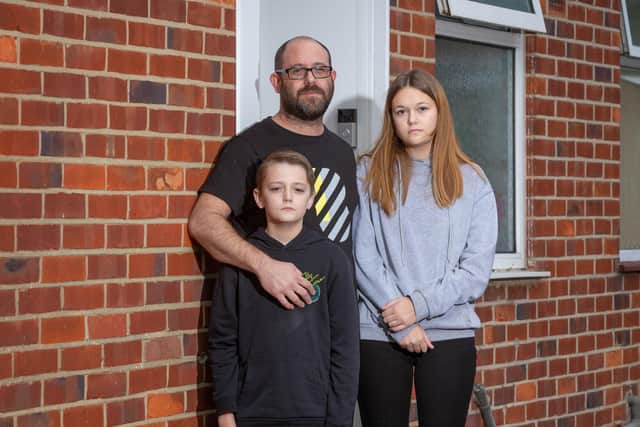 Scott Stoneage with his children, Tegan 13 and Charlie 11 isolating in their home in Fareham
Picture: Habibur Rahman