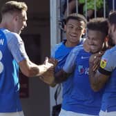 Josh Koroma is congratulated by his Pompey team-mates following his first-half opener against Plymouth. Picture: Barry Zee
