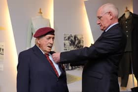 Arthur Bailey is presented with his medal from Captain Francois Jean, the consul honoraire of France, on behalf of French president Francois Hollande. 

At a ceremony at D-Day Museum, Southsea, veterans are presented with France's highest military honour Legion d'Honneur for their heroism during the D-Day landings in Normandy. 2015.

Picture: Allan Hutchings