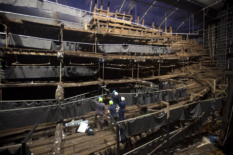Conservators work on the remains of the Mary Rose at the new Mary Rose Museum at Portsmouth's Historic Dockyard on May 16, 2013. Picture: Dan Kitwood/Getty Images