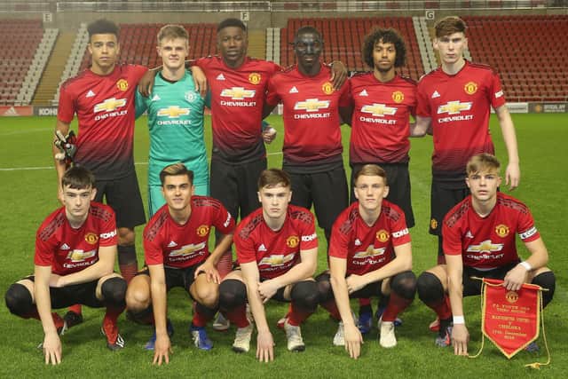 Di'Shon Bernard (back row, third from the left) pictured with his Manchester United under-18 teams-mates in December 2018. (Back Row L-R: Mason Greenwood, James Thompson, Di'Shon Bernard, Aliou Traore, D'Mani Bughail-Mellor, James Garner. Front Row L-R: Dylan Levitt, Arnau Puigmal, Charlie McCann, Ethan Galbraith, Brandon Williams). Picture: Matthew Peters/Manchester United via Getty Images