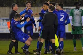 Baffins defender Rhys Lloyd falls to the ground in the melee which broke out at the end of the Wessex League win against Blackfield & Langley last night. Picture: Martyn White.