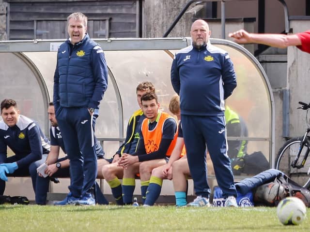 Fraser Quirke, left, and Glenn Turnbull in the same Victory Stadium dugout for Moneyfields last season. This weekend they will be in opposite dugouts.