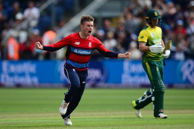 Mason Crane celebrates taking the wicket of South African star AB De Villiers during his second England T20 international appearance in Cardiff three years ago. Photo by Harry Trump/Getty Images.