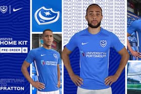 Marcus Harness, centre, models Pompey's new home shirt for the 2021-22 season.  Picture: Portsmouth FC