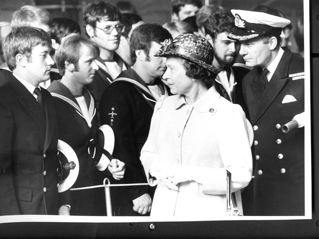The Queen meets the crew of HMS Invincible during a walkabout in the ship's hangar on September 17, 1982. The News PP4043