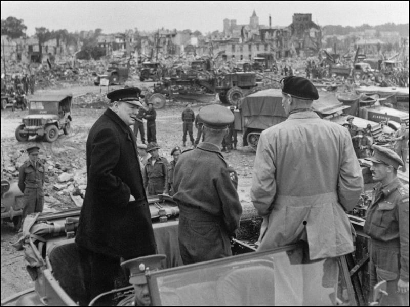 (From left) British Prime minister Winston Churchill, Sir Miles Dempsey, British 2nd Army commandant, and British general Marshal Bernard Montgomery visit destroyed city of Caen, 23 July 1944 after Allied forces stormed the Normandy beaches on D-Day. (Photo credit should read STF/AFP/Getty Images)
