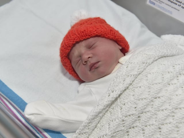 Eva Cooke born on Christmas Day at 7.38am weighing 6lb 14oz to parents Charlotte and Sam Cooke both 34 from Bournemouth. Eva was born via a surrogate from Havant. 

Picture: Sarah Standing