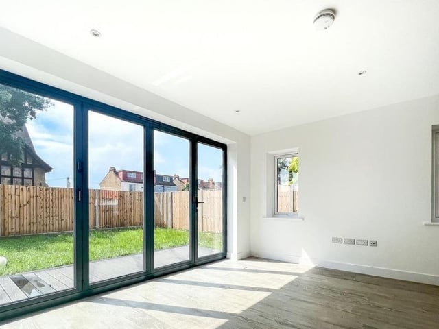This property comes with four bedrooms, two bathrooms and three reception rooms.