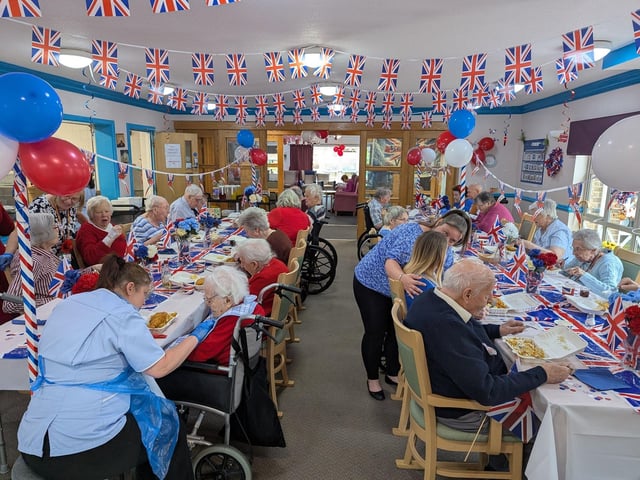 Residents at RCC enjoy a street party lunch