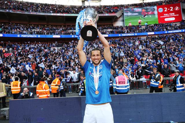 Pompey defender Christian Burgess with the Checkatrade Trophy after last season's Wembley triumph