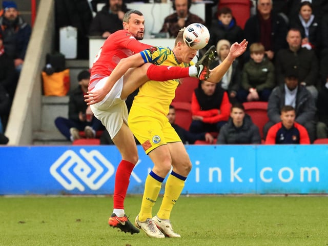Haydn Hollis boot is high on Hawks striker Danny Wright. Picture by Dave Haines