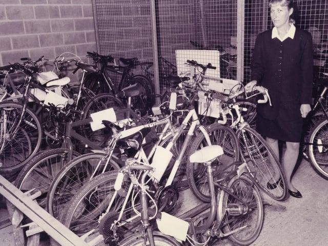WPC Clare Harley of Fareham police station, with some of the many unclaimed bikes at the station, after a raise in bike crime in the area, October 1995. The News PP5528