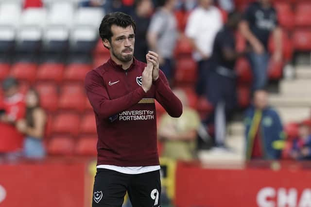 John Marquis applauds the travelling Pompey fans at the final whistle.  Picture: Jason Brown